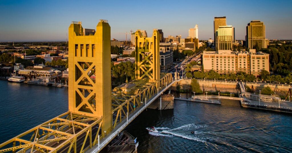 Sacramento Tower Bridge at sunset with Midtown Sacramento cityscape